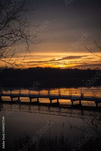 Wallpaper Mural Orange sunset on the lake with the bridge and phragmites silhouettes Torontodigital.ca