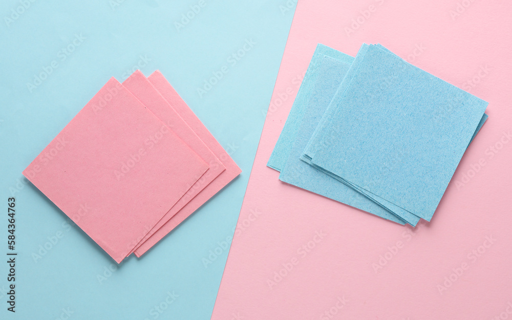 Fototapeta premium Blue and pink memo square papers on a blue-pink pastel background. Template for design