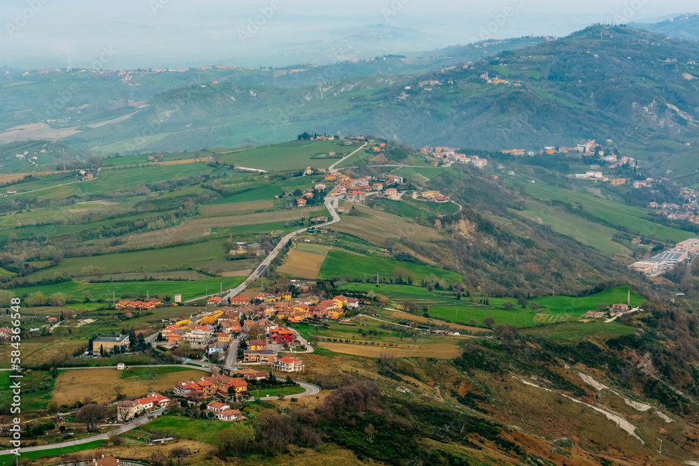 Top view of the hilly green landscape of San Marino from the Falesia Second tower