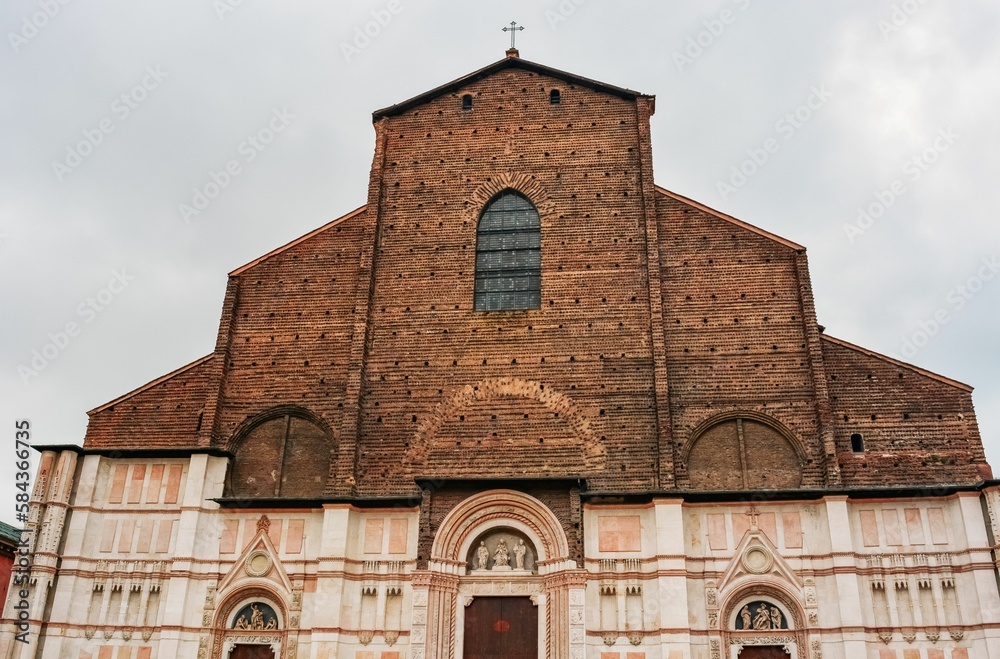 Basilica of San Petronio under a cloudy sky in Bologna, Italy
