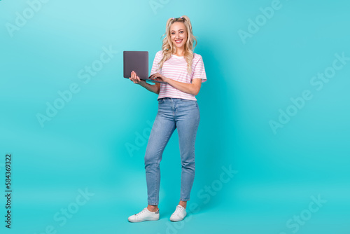 Full body photo of gorgeous positive lady hold use wireless netbook isolated on turquoise color background