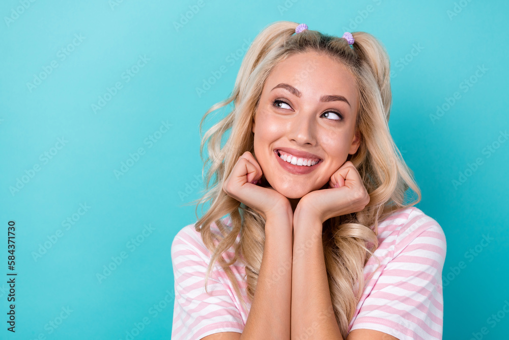 Photo of positive cheerful cute adorable lady wear two arm under face demonstrate makeup enjoy good mood isolated on cyan color background Photo of positive cheerful cute adorable lady wear two arm under face demonstrate makeup enjoy good mood isolated on cyan color background