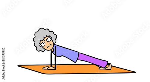 Aktive Seniorin in Brett-Stellung beim Yoga photo