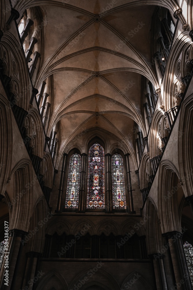 Low angle shot of the stained glass window inside Salisbury Cathedral, England