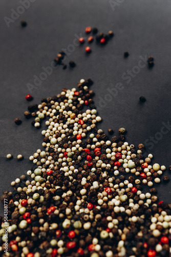 A peppercorn mix on a black background 