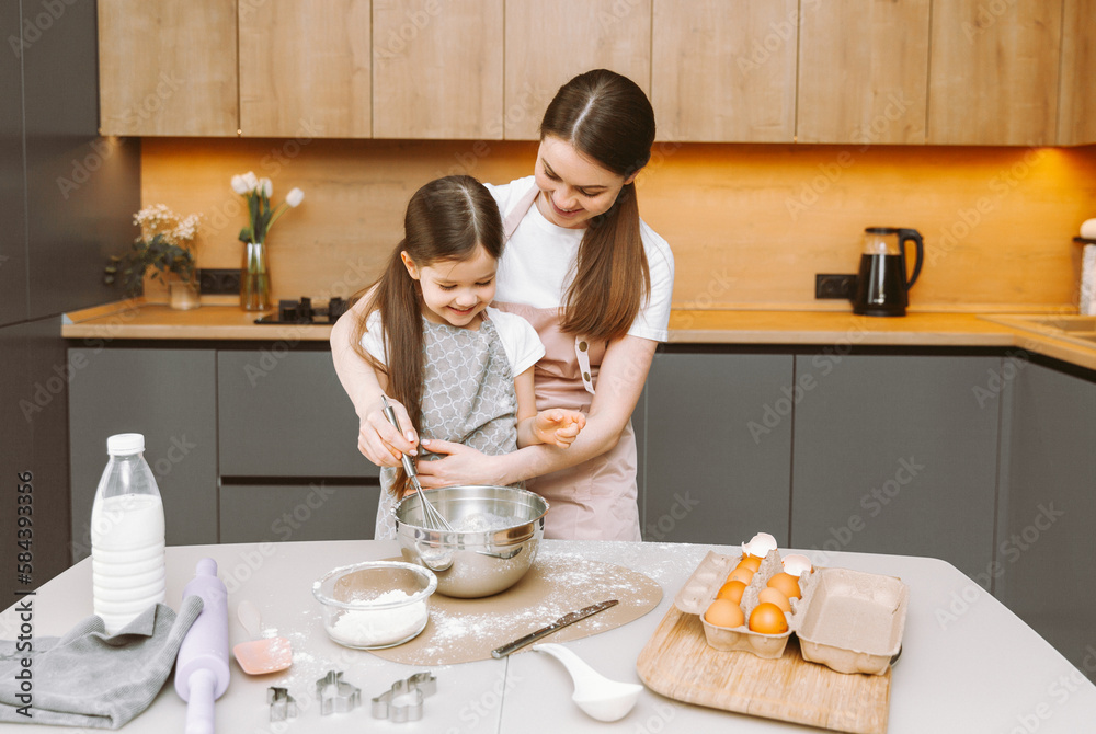 happy family in the kitchen. mother and daughter prepare dough, bake cookies, Easter cake. happy family in the kitchen. mother and daughter prepare dough, bake cookies, Easter cake.