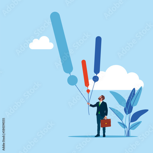 Cuadro en lienzo Businessman hand holding exclamatory mark