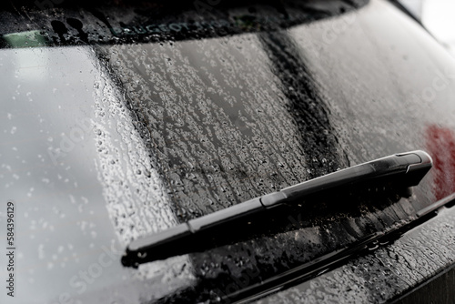Car rear window wiper cleaner an rainy glass