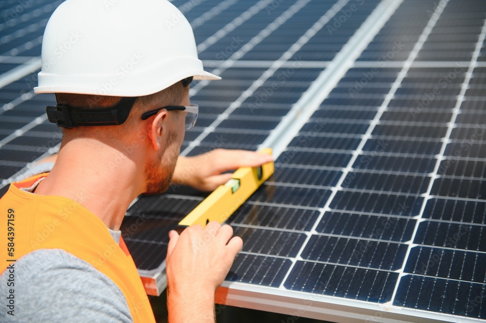 A man working at solar power station. A man working at solar power station.