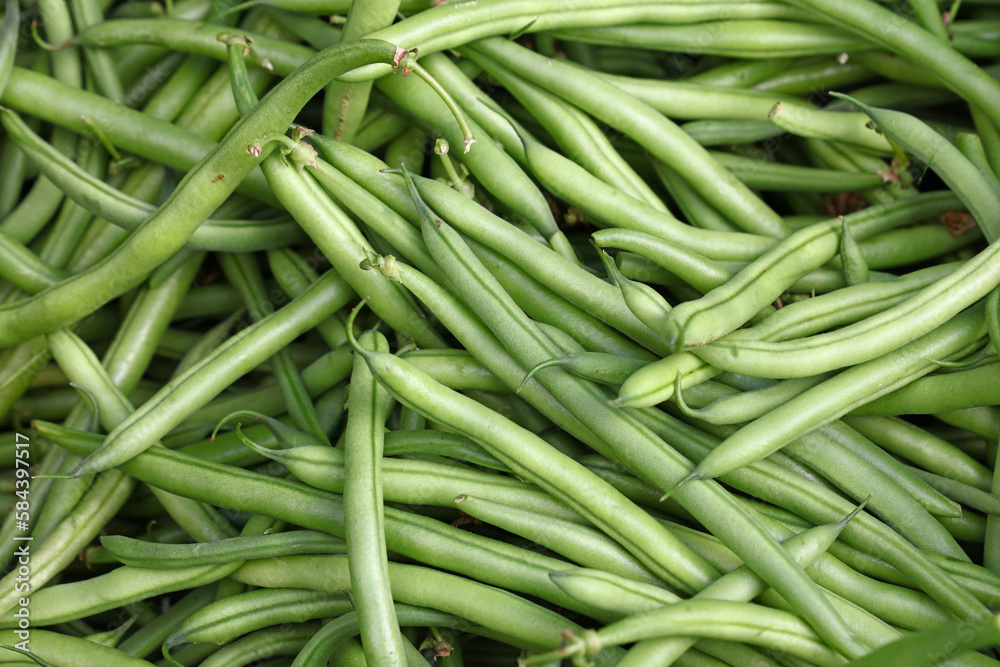 Heap of fresh green beans on market stall Heap of fresh green beans on market stall