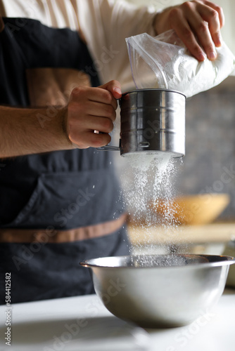 Luxurious cake with unique decor created by an experienced pastry chef flour sifting