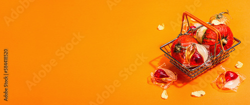 Sale concept for machine washing. Capsules with detergent and autumn decor in traditional basket