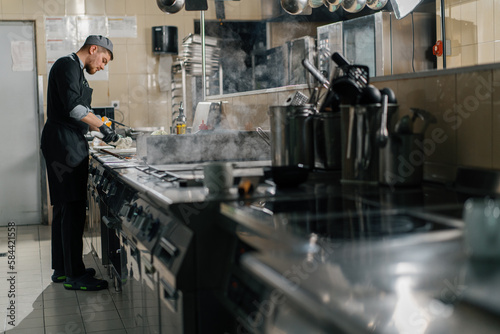 professional kitchen in the restaurant of the hotel the chef prepares meals cooking