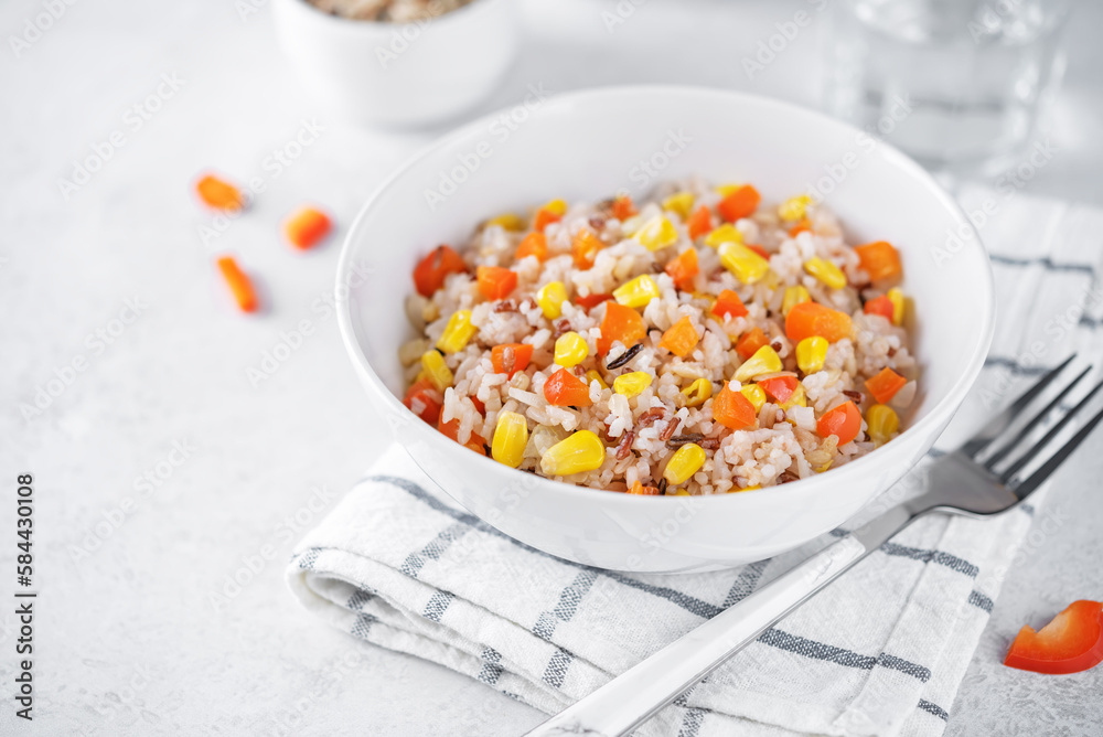 Corn red bell pepper black and white and brown rice in a bowl Corn red bell pepper black and white and brown rice in a bowl