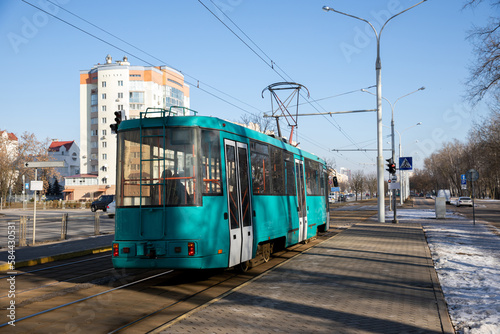 Tram rides in the city in winter.