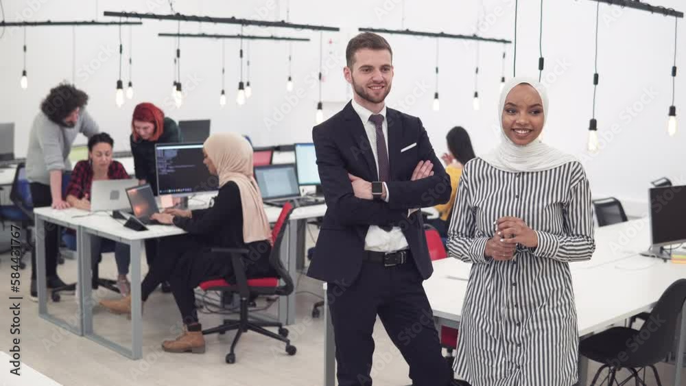 Group of successful business people, manager and muslim woman standing in the coworking office Group of successful business people, manager and muslim woman standing in the coworking office