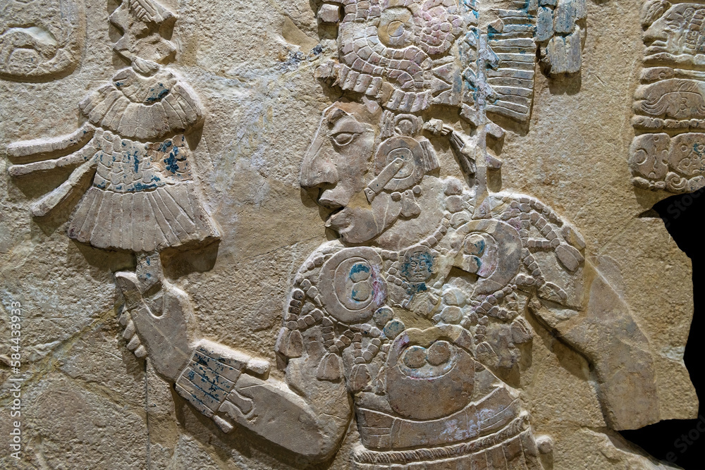 Maya bas relief carving in a stele tombstone of mayan ruler king, Palenque, Mexico. Stock Photo