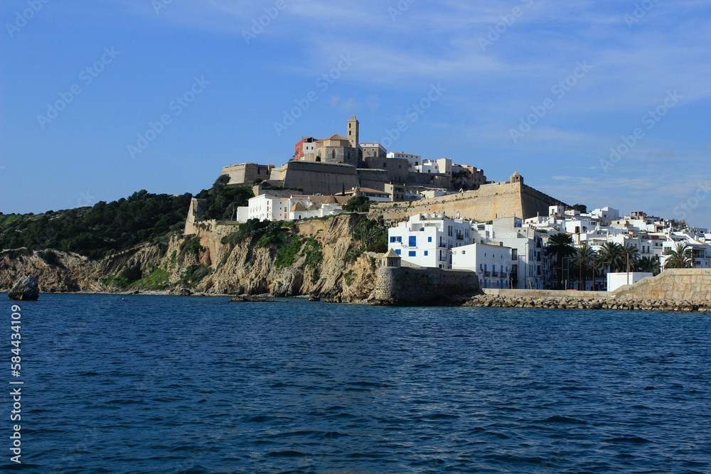 The old town and the castle of Ibiza seen from the sea. The port and marina of the tourist center of the island. Medieval walls and dalt vila. The old town and the castle of Ibiza seen from the sea. The port and marina of the tourist center of the island. Medieval walls and dalt vila.