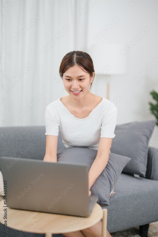 Happy asian woman speak conference on laptop in video call people smart working from home Happy asian woman speak conference on laptop in video call people smart working from home