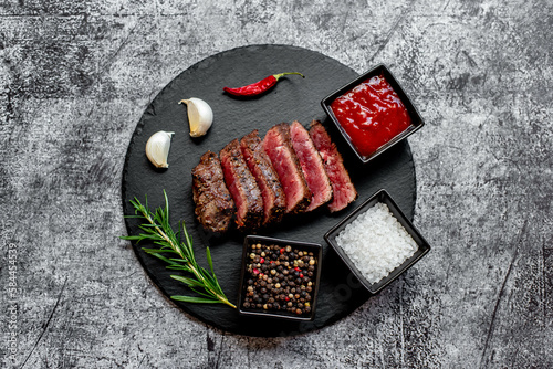 grilled beef steak on stone background 