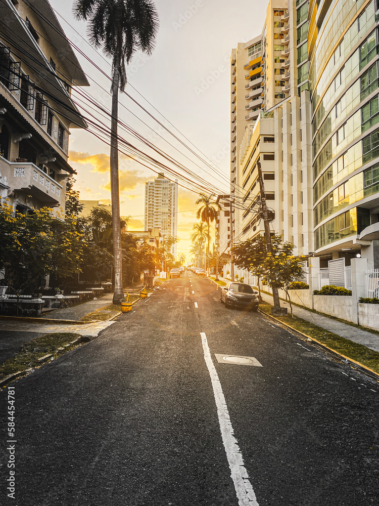 Beautiful sunset behind office buildings along a lonely road in Panama City, Panama.