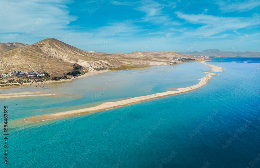 Stunning high aspect aerial panoramic view of the beautiful tropical looking beach, lagoon and sand dunes at SotaventoRisco del Paso beach near Costa Calma on Fuerteventura Canary Islands Spain