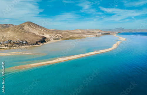 Stunning high aspect aerial panoramic view of the beautiful tropical looking beach  lagoon and sand dunes at SotaventoRisco del Paso beach near Costa Calma on Fuerteventura Canary Islands Spain