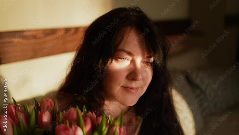 Gentle woman with a bouquet of flowers Gentle woman with a bouquet of flowers