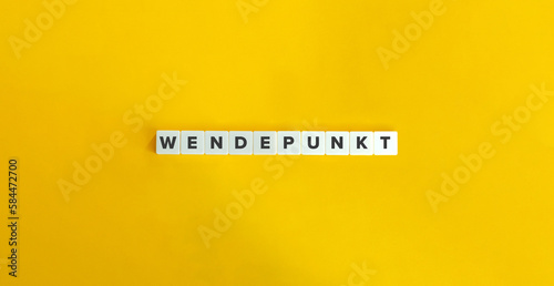 Wendepunkt Word (Turning Point in German Language). Letter Tiles on Yellow Background. Minimal Aesthetics.
