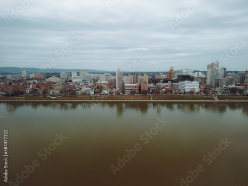 Aerial drone view of city along river. 