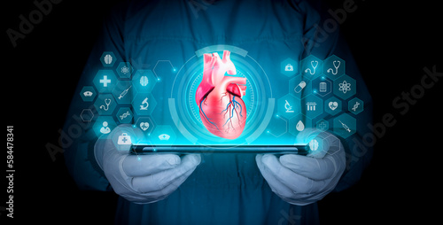 human heart. Cardiology, heart problems, heart disease digital medicine modern digital health. chf cardiomyopathy, myocarditis, arrhythmia. Doctor with tablet, concept in medical technology.