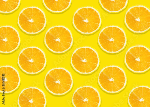 Bright summer background. Lemon slices on yellow. Fruits seamless pattern. texture design for wallpaper
