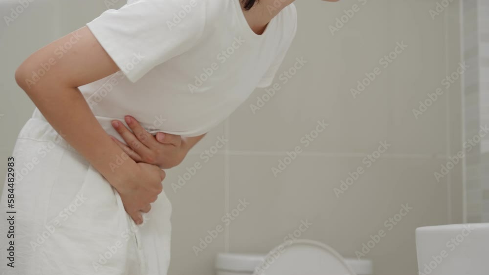 Constipation and diarrhea in bathroom. Hurt woman touch belly stomach