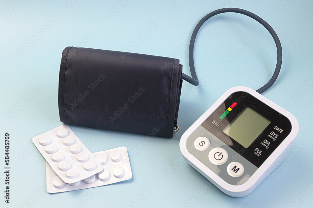 Medical tonometer for measuring blood pressure on blue background. Health care and Medical concept Medical tonometer for measuring blood pressure on blue background. Health care and Medical concept