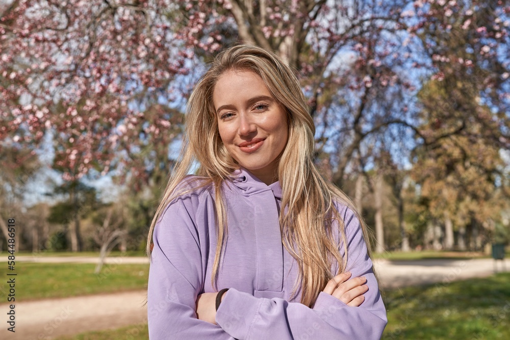 Joyful young woman under beautiful flowering tree. Joyful young woman under beautiful flowering tree.