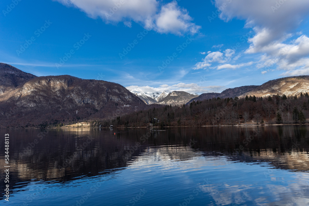 Lake Bohinj in winter in Slovenia against the background of the snowy Alps
