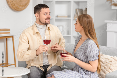 Young couple with glasses o...