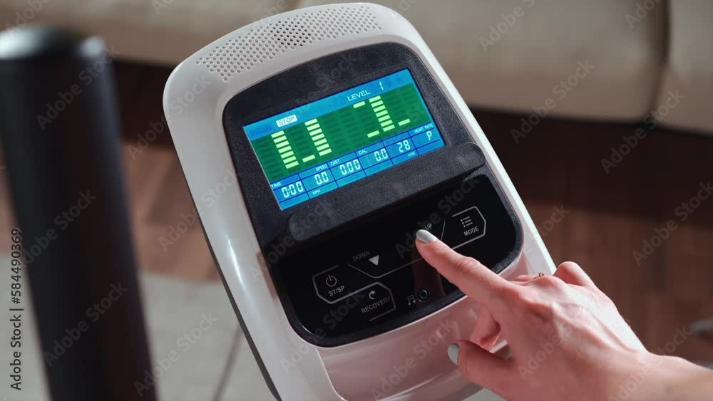 hand press key on running treadmill digital display or choosing training program hand press key on running treadmill digital display or choosing training program
