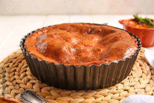 Golden brown baked pie in f...