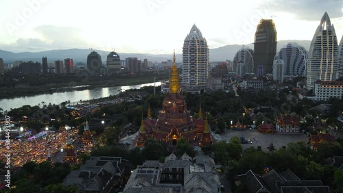 Buddhist Temple and City Buildings in Chinese Touristic Travel Destination of Xishuangbanna - Aerial photo