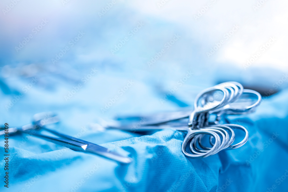 Surgical clamps and medical equipment on surgical tray.Surgical