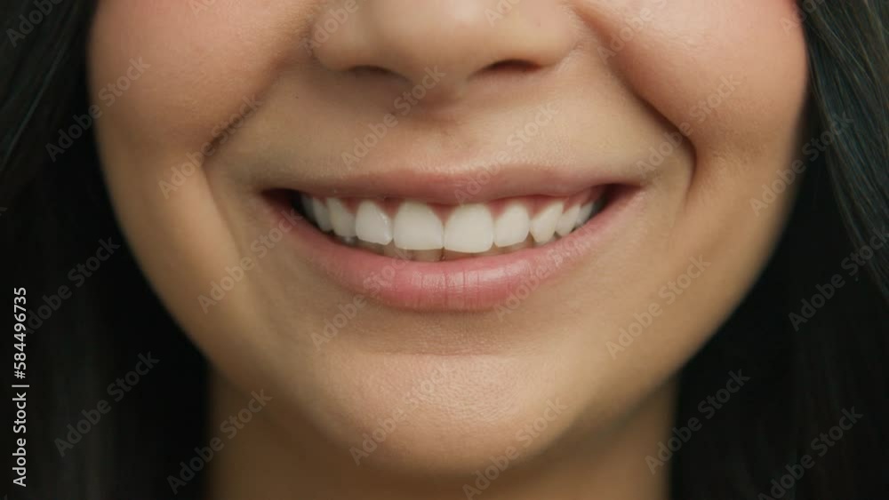 Happy Smiling People Close-up Concept. Casual female with healthy skin and beautiful white teeth smiling cheerfully and background of pink lips. Expressive emotional fun and joy lifestyle concept 4K Happy Smiling People Close-up Concept. Casual female with healthy skin and beautiful white teeth smiling cheerfully and background of pink lips. Expressive emotional fun and joy lifestyle concept 4K