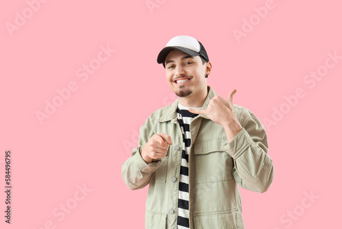 Cool young man showing "cal...