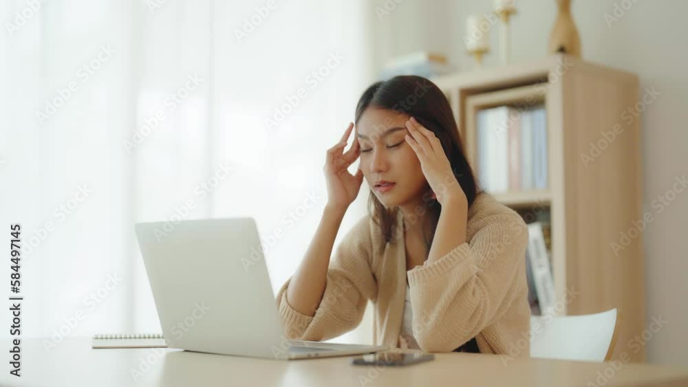 Office syndrome. Overworked tired young asian woman feeling headache, having eyesight problem after computer laptop work. Stressed young woman suffering from fatigue at home Office syndrome. Overworked tired young asian woman feeling headache, having eyesight problem after computer laptop work. Stressed young woman suffering from fatigue at home