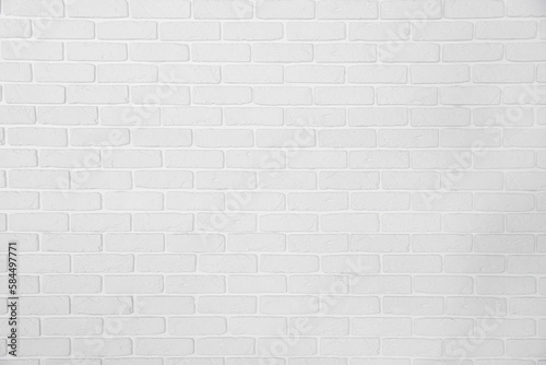 Decorative white bricks with tile leveling system on wall