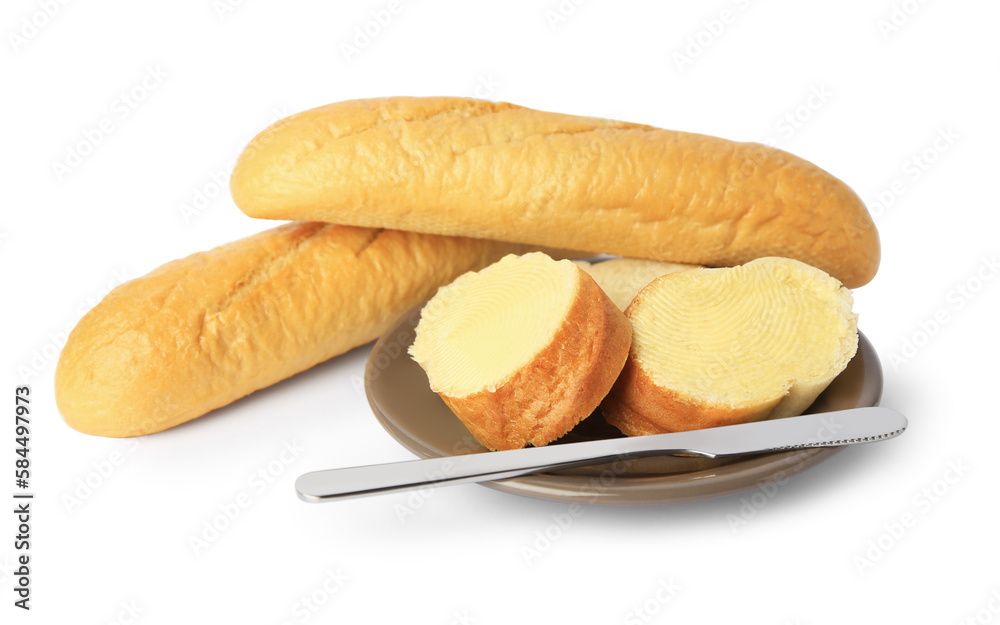 Whole and cut baguettes with fresh butter on white background Whole and cut baguettes with fresh butter on white background