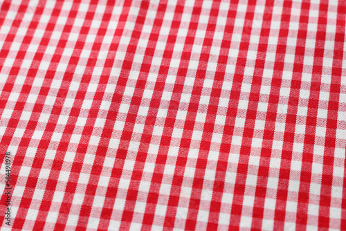 Red checkered tablecloth as background, closeup view