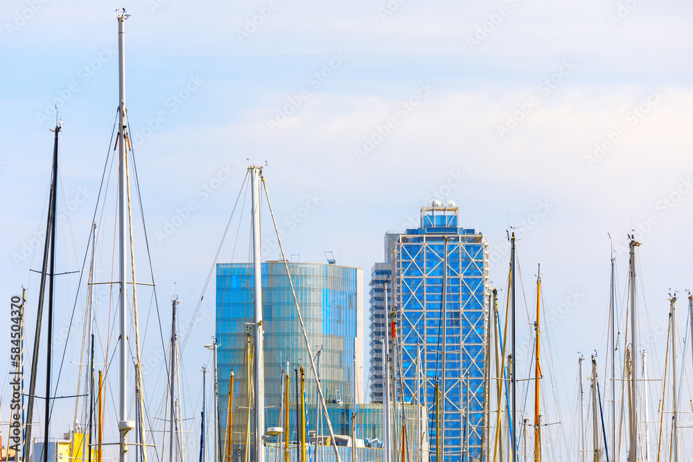 Yacht masts and skyscrapers . Modern harbor in the city Yacht masts and skyscrapers . Modern harbor in the city