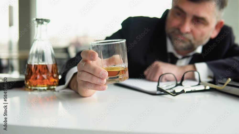 Drunk senior employee sleeping at working place. Alcoholism, drinking concept Drunk senior employee sleeping at working place. Alcoholism, drinking concept
