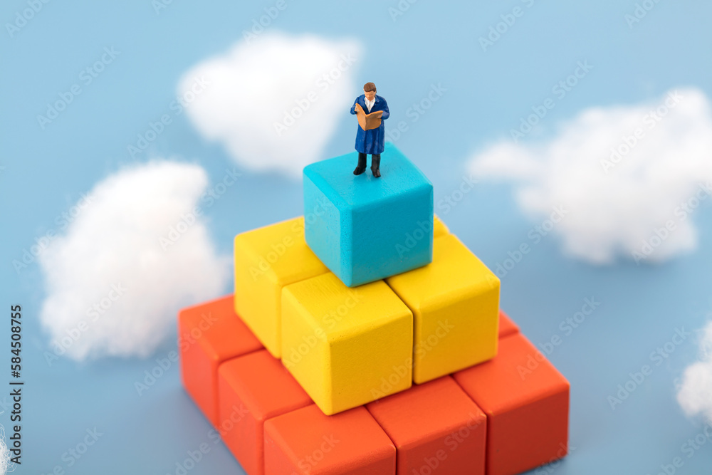 Miniature creative reading on cloud building blocks Miniature creative reading on cloud building blocks